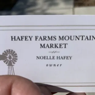 hand holding business card