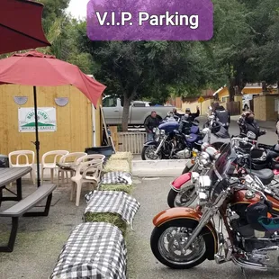 several motorcycles parked in a parking lot