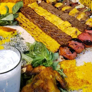 Special platter with chicken and beef kabobs and Doogh