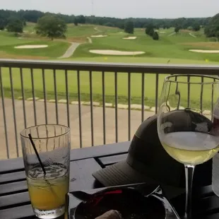 Taking a break from the heat with Drinks and a cigar at the course here.