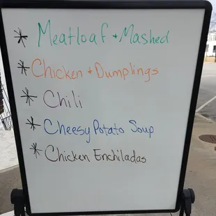 a white board with a list of chicken dumplings