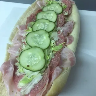 a sandwich with cucumbers and ham