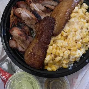 Boneless Chicken Bowl w/ plantains and street corn. Side of Aji Cilantro Sauce and Hahabanero Hot Sauce