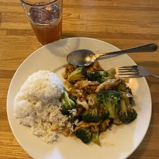 Chicken and broccoli with steamed rice.