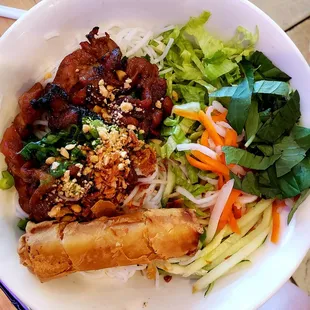 Rice vermicelli with grilled pork and spring roll