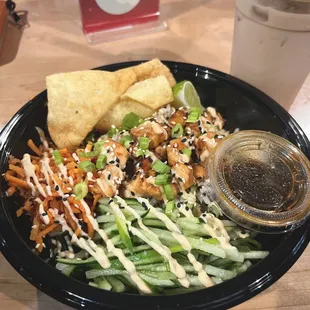  a bowl of food and a drink