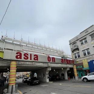 the asian on third sign above a parking garage