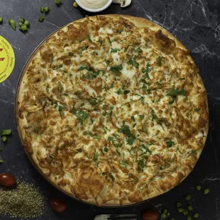 Chicken Pizza: Mozzarella cheese, fresh mushrooms, shredded chicken, and fresh parsley