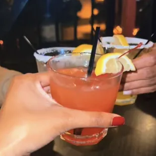 a person holding a drink