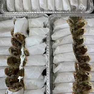 two trays of sandwiches
