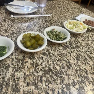 All the yummy sauces and sides that came with our orders.