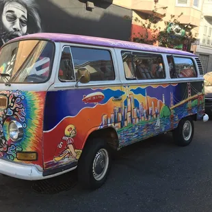 a colorful bus on a city street