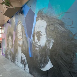 a mural of a man with long hair