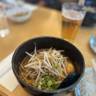 a bowl of soup and a plate of rice