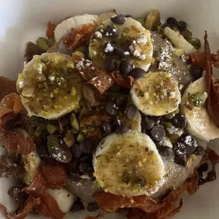 This is the quake roll. It has banana, pistachios, carrot bacon and mini chocolate chips.