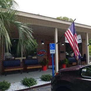 a car parked in front of a restaurant