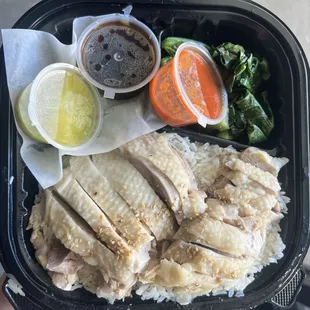 a person holding a tray of food