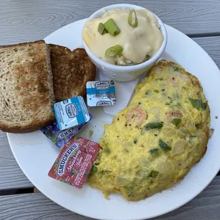 Shrimp and crab omelette w/ cheese grits w/ wheat breads