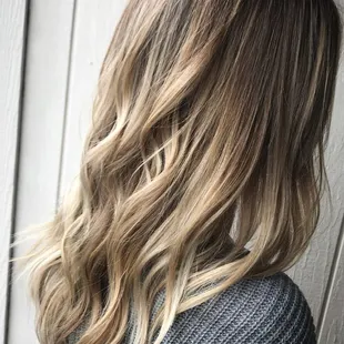 Foiliage. It blends babylights and balayage in foil for that soft blend.