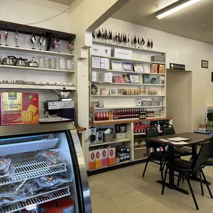 the inside of a restaurant with tables and chairs