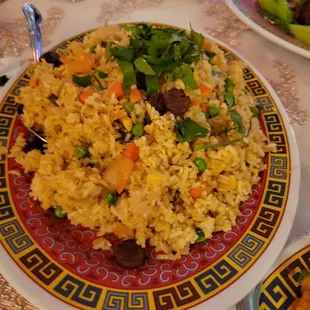 a plate of rice and vegetables