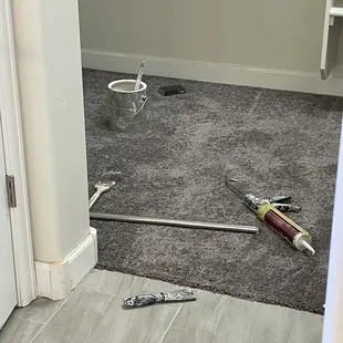 A board was left in the driveway for 2 weeks before it was painted. No drop cloths we have paint and caulk on our carpet.