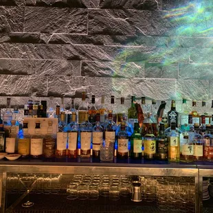 a bar filled with liquor bottles