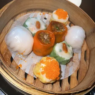 a variety of food in a bamboo basket