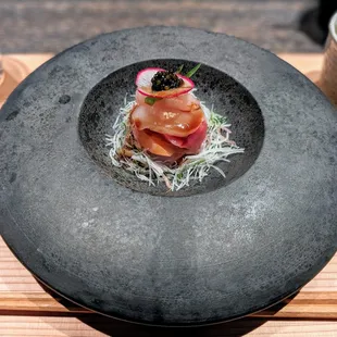 a plate of food on a wooden table