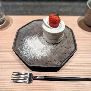 a dessert with a strawberry on top