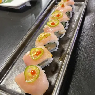 a long rectangular plate of sushi