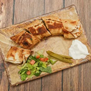 a plate of food on a wooden table