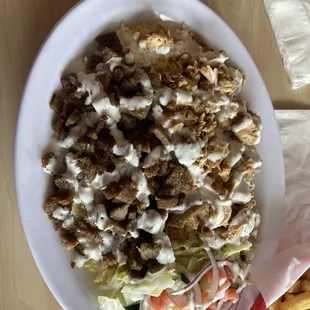 a plate of salad and fries