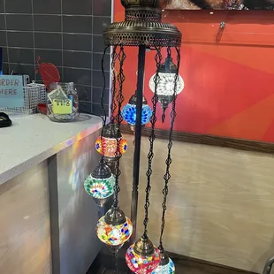 a display of colorful glass balls on a stand