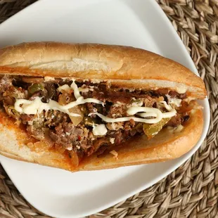 Philly Cheesesteak
Pieces of steaks,  Mayonnaise, cheese, onion, bell pepper, and mushroom.