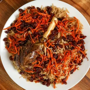 Qabuli Palaw
Rice mixed with Carrots and Raisins comes with one Lamb Shank
