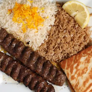 Koobideh (Beef)
Two skewers of ground beef mixed with spices and grated onion, and rice.