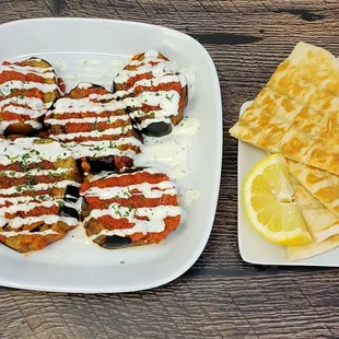 Fried Eggplant 
Tomato Sauce, Tzatziki Sauce and One Pita Bread