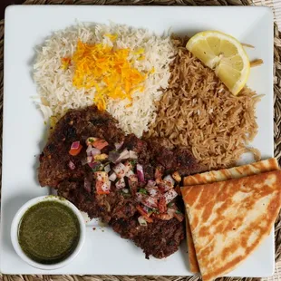 Two pieces of ground beef mixed with spices, onion, garlic, bell peppers. Comes with rice.