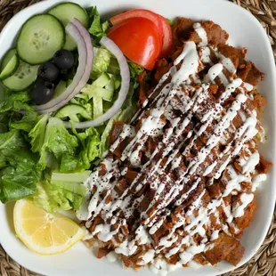 Gyro Plate, Rice, salad (cucumber, lettuce, onions, tomato), tzatziki sauce. Add feta cheese for an extra charge.
