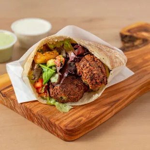 You can&apos;t go wrong with falafel in a pita pocket, paired with Mediterranean salad and hummus! Delicious!