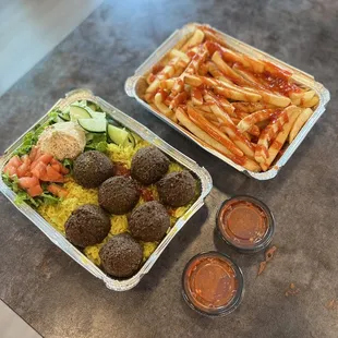 two takeout containers of food on a table