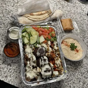 Combo over rice, hummus, backlava, pita bread