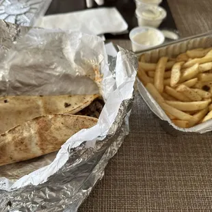 Two of these wraps and one order of fries seen here with no drinks was $40. Wayyyy too expensive.