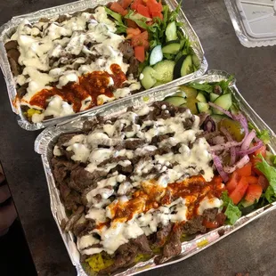 two trays of food on a table