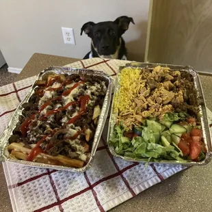 Loaded fries with added Lamb Shawarma, easy on sauces. Combination plate over rice (chicken, lamb, tomatoes, cucumbers, lettuce salad).