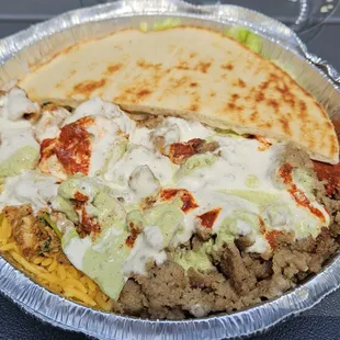 Combo plate with additional mint, white, and extra hot sauce.