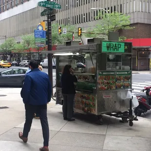 a food cart on a city street