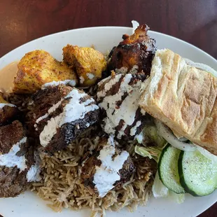 Lamb and chicken tikka combo served over brown rice