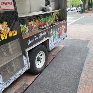 a food truck parked on the side of the road